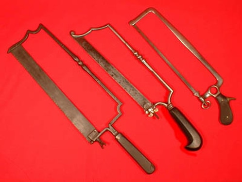 Antique medical amputation saws.