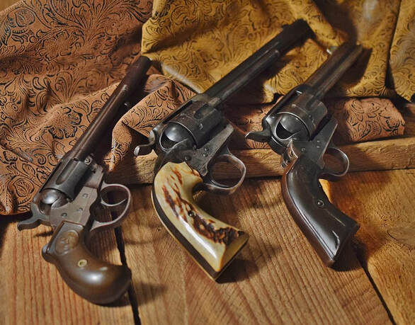 Three 1880 Colt revolvers. Photograph by Suzanne Taylor.